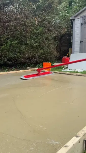 Completed concrete slab being power-floated to a smooth surface