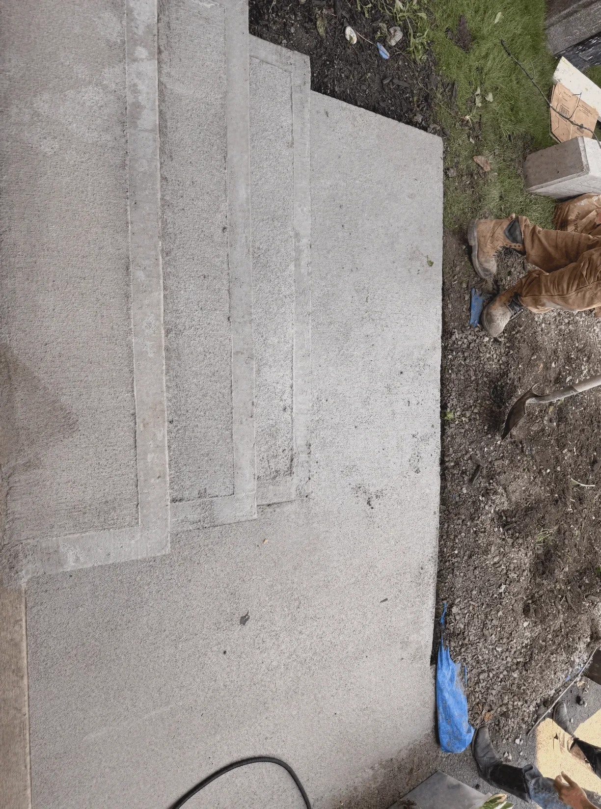 Finished concrete steps and patio slab ready for use